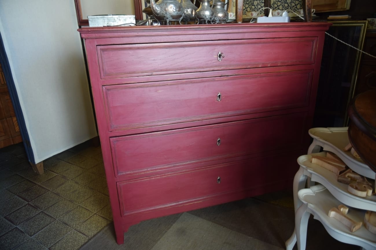 Red lacquered chest of drawers Jane Harman storage and furniture restoration in Florence